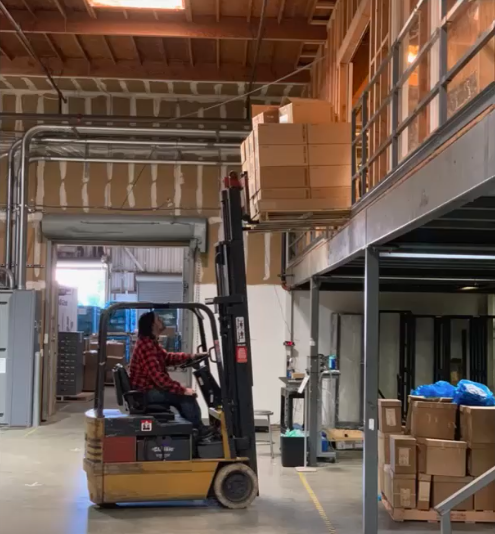 Employee carries the equivalent of 10 petabytes of hard drives that were purchased to integrate the Internet Archive infrastructure. Photo: Internet Archive.